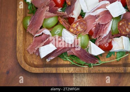 hearty snack with ham, cheese and salami in a restaurant in Italy Stock Photo