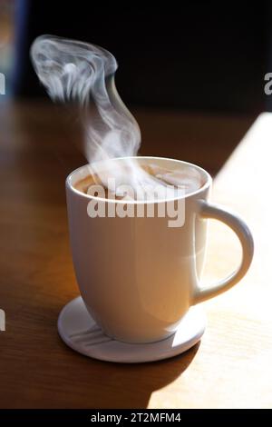 Steam rising off a mug of coffee on a cold day Stock Photo - Alamy