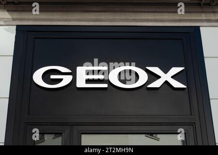 Sign and logo of a Geox store. Geox is an Italian footwear and ready-to-wear clothing company Stock Photo