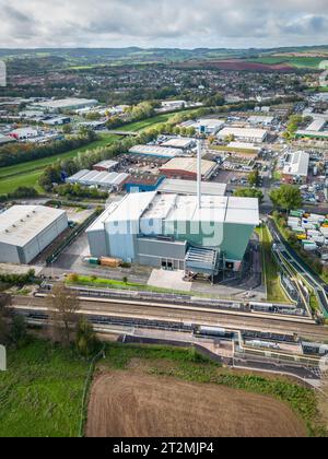 Exeter, UK. 20th Oct, 2023. Aerial view over the recently opened Marsh Barton Train Station and the exterior of the Exeter Energy Recovery Facility Credit: Thomas Faull/Alamy Live News Stock Photo