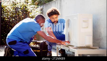 Commercial HVAC Air Conditioner Service By Electric Stock Photo