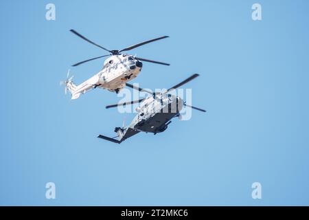 Madrid, Spain - October 12, 2023: Airbus NH-90 and Eurocopter AS-332 Super Puma helicopters during the parade of the armed forces on the day of the Sp Stock Photo