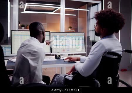 Analyst Working With Spreadsheet Business Data On Computer Stock Photo