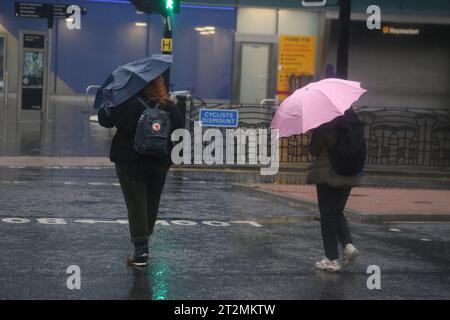 Newcastle, UK. 20th Oct 2023. Storm Babet - People battle the weather in Newcastle City Centre as second Red warning issued by the Met Office. Storm Babet has already brought significant impacts, particularly to eastern England and Scotland. Newcastle upon Tyne, UK, October 20th, 2023, Credit: DEW/Alamy Live News Stock Photo