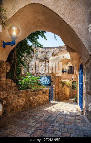 Tel Aviv, Israel - August 17, 2023: Narrow cobblestone street in the old town of Jaffa, Tel Aviv, Israel Stock Photo