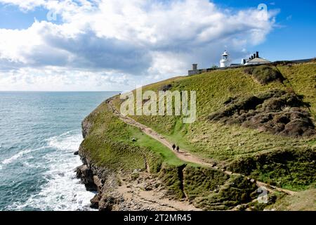 A view along the south west coast path from Durlston Point to Anvil Point on the Jurassic Coast, Dorset, UK. A popular walking route for hiking Stock Photo