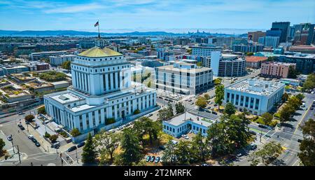 Aerial Alameda County Superior Courthouse in downtown Oakland California with distant San Francisco Stock Photo