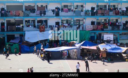 October 20, 2023: Gaza, Palestine. 20 October 2023. Tents have been set up next to an UNRWA school in Deir al Balah, to be used as shelter by displaced Palestinians during the ongoing Israeli military offensive in Gaza. The Gaza Strip has been under heavy bombardment for the 14th consecutive day, with a large number of displaced Palestinians struggling to find safety in the besieged and overcrowded tiny Palestinian enclave (Credit Image: © Adel Al Hwajre/IMAGESLIVE via ZUMA Press Wire) EDITORIAL USAGE ONLY! Not for Commercial USAGE! Stock Photo