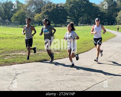 High school long distance runners tgraining in Prospect Park, Brooklyn, BNew York in the autumn. Stock Photo