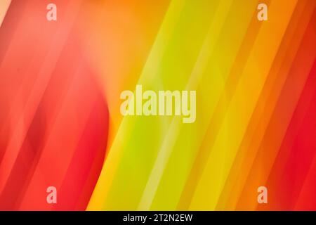 Streaks of bright yellow colors in diagonal lines framed by red lines abstract background asset Stock Photo