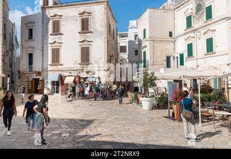 Polignano a Mare, Puglia, Italy - October 4, 2023: The square with bars and restaurants in the center of the Polignano a Mare village. Stock Photo