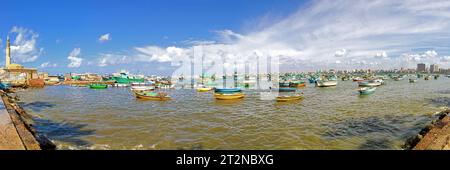 Alexandria, Egypt - February 28, 2010: Long Panorama of Fisherman Boats at Harbour Bay in Alexandria, Egypt. Stock Photo