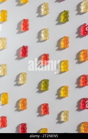 Colorful multi-colored jelly candies isolated on a white background in the form of vertical lines. Jelly Bean, fruit gummy candies background. Stock Photo