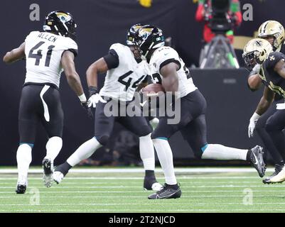 New Orleans, USA. 19th Oct, 2023. Jacksonville Jaguars linebacker Foyesade Oluokun (23) returns an interception for a 24-yard touchdown during the 6:47 mark in the third quarter of a National Football League game at Caesars Superdome in New Orleans, Louisiana on Thursday, October 19, 2023. (Photo by Peter G. Forest/Sipa USA) Credit: Sipa USA/Alamy Live News Stock Photo