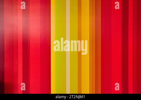 Cartoonish vertical yellow colored lines with red on outer edges abstract background asset Stock Photo