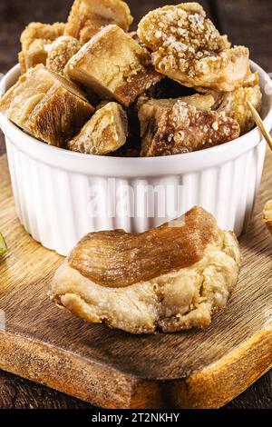 Crackling bowl, Brazilian appetizer made by frying bacon, leather or meat and lots of fat, taken from the pork belly. Stock Photo