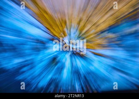 Burst of white light blur with blue on bottom and gold on top in background asset Stock Photo