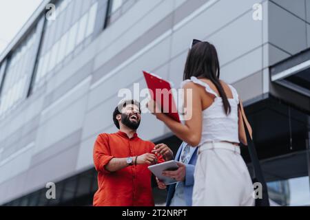 Architects discussing financial and sustainable design for a new project. Teamwork and innovation driving profitable architecture. Stock Photo