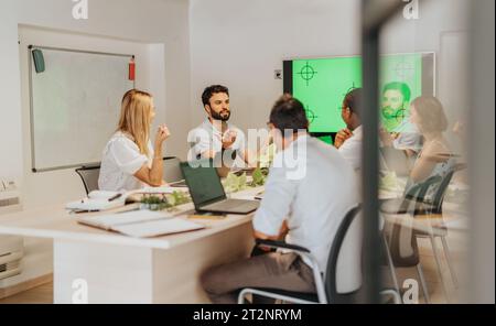 Successful Collaboration and Innovation in a Modern Business Meeting Stock Photo