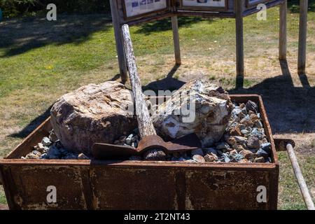 ore, pick ax in an old coal car Stock Photo