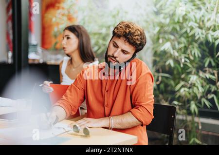 Architectural Team Discussing Profitable Sustainable Design Project Plans Stock Photo