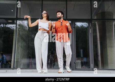 Architects discussing project costs and paperwork, coordinating with engineers and contractors for profitable and sustainable urban planning. Stock Photo