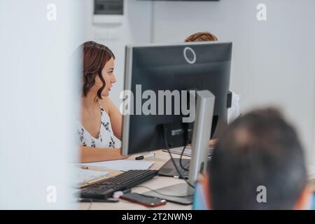Efficient Team Analyzing Reports for Profit Growth in Business Casual Office Stock Photo
