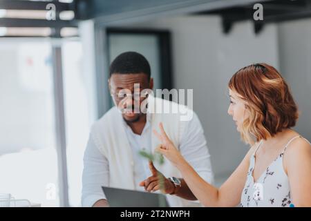 In a modern office, a diverse business partners collaborates on content creation and effective marketing strategies to reach their target audience. Stock Photo