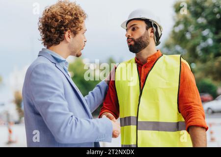 Architects discuss sustainable design, plan projects, and inspect blueprints. Team coordination and innovation in an industrial workplace. Stock Photo