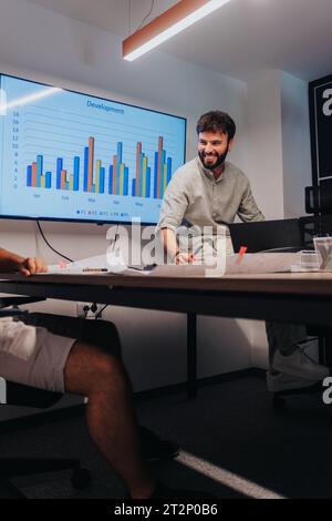Collaborative Business Team Brainstorming Ideas and Developing Project Strategies in Modern Boardroom Stock Photo