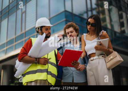 Architects and Engineers Collaborating on Urban Development Project Stock Photo