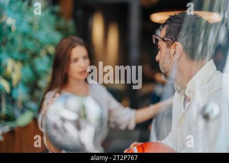Experienced managers discussing project costs, analyzing projects for better efficiency. Successful teamwork and collaboration in corporate setting. Stock Photo