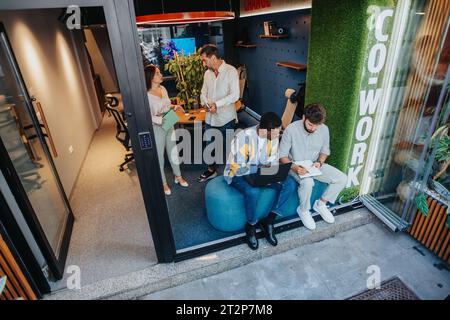 Collaborative Workspace: Diverse Group of Successful Professionals Working Together on New Projects Stock Photo
