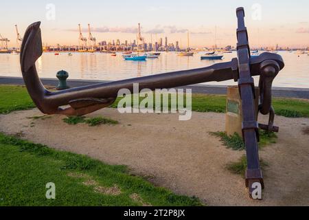 A large historic anchor lying in a waterfront reserve alongside a calm bay at Williamstown in Melbourne, Victoria, Australia Stock Photo