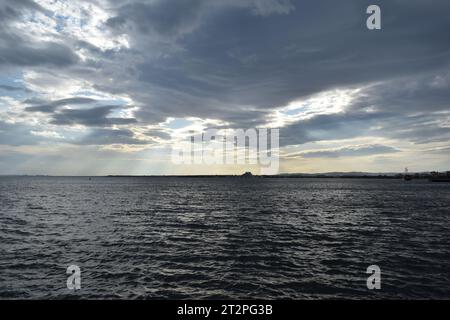 Tranquil sea horizon with blue sky and soft clouds Stock Photo