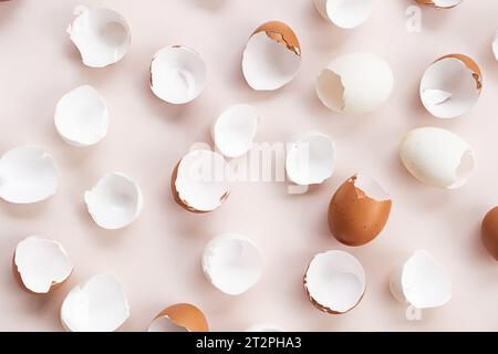Springtime easter layout. Empty broken chicken eggshells. Stock Photo