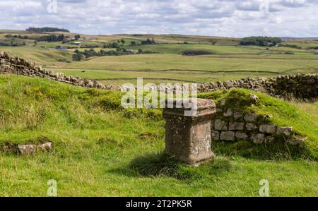 Roman temple altar stone at Great Chester Fort (Aesica) on Hadrian's Wall Path, near Greenhead, Northumberland, UK Stock Photo