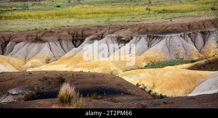 yellow bands in the fantastically colored and eroded paint mines out in the prairie on a sunny day, near calhan, el paso county, colorado Stock Photo