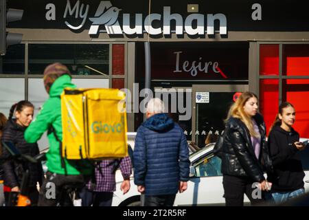 Bucharest, Romania - October 18, 2023: People walk past a store of the French multinational retailer, Auchan. Stock Photo