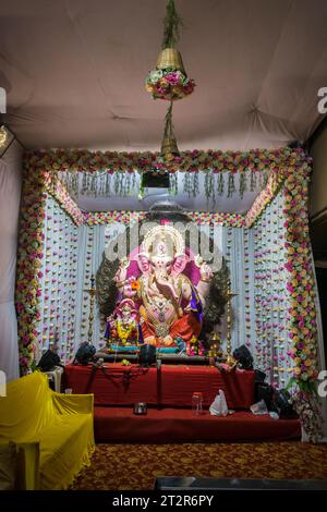 A beautiful idol of Lord Ganesha being worshipped at a mandal in Mumbai for the auspicious Indian festival of Ganesh Chaturthi Stock Photo