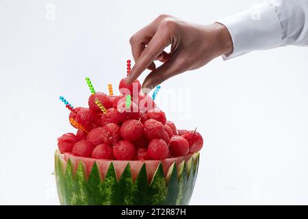 Fresh watermelon in scoop shape. Sliced of watermelon isolated on white background. Stock Photo