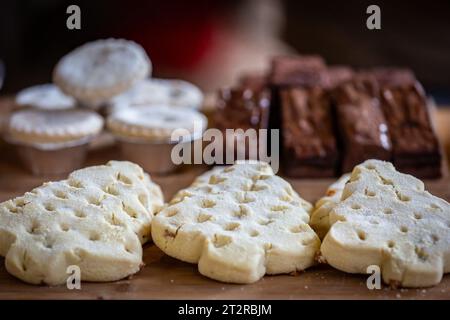 A close up of Christmas biscuits and cakes on a market stall, with a shallow depth of field Stock Photo