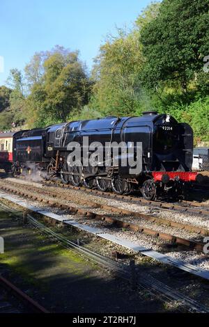 BR Standard Class 9F 2-10-0 No 92214 at Goathland station on the North Yorkshire Moors Railway during its 50th anniversary gala. Stock Photo