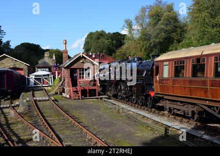 Running tender first, BR Standard Class 4 No 75069 arrives at Goathland on the North Yorkshire Moors Railway during its 50th anniversary gala. Stock Photo