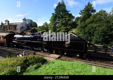 Running tender first, BR Standard Class 4 No 75069 waits to leave Goathland on the North Yorkshire Moors Railway during its 50th anniversary gala. Stock Photo