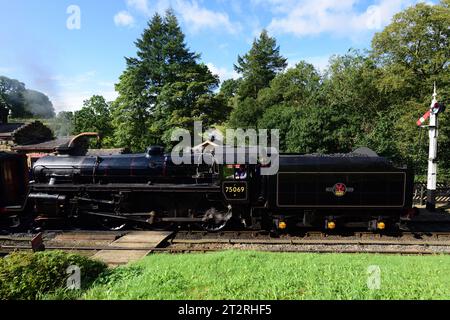 Running tender first, BR Standard Class 4 No 75069 waits to leave Goathland on the North Yorkshire Moors Railway during its 50th anniversary gala. Stock Photo