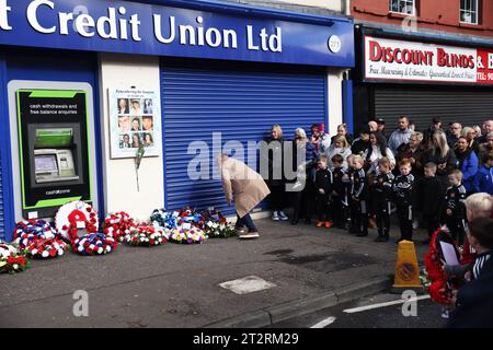 A person lays a wreath on Shankill Road in Belfast, during an event to mark the 30th anniversary of the Shankill bomb. Picture date: Saturday October 21, 2023. Stock Photo