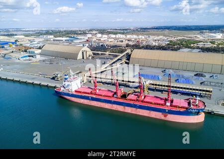 Huelva, Spain - October 21, 2023: Aerial drone view of CL FUZHOU HE, a Bulk Carrier that was built in 2021and is sailing under the flag of Liberia. Mo Stock Photo