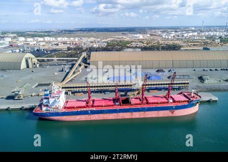 Huelva, Spain - October 21, 2023: Aerial drone view of CL FUZHOU HE, a Bulk Carrier that was built in 2021and is sailing under the flag of Liberia. Mo Stock Photo