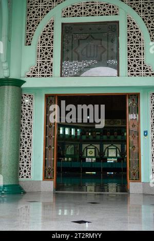 Arabic, Indonesian. Beautiful mosque entrance with Arabic ornaments. without looking from the front with a parallel viewpoint. Stock Photo